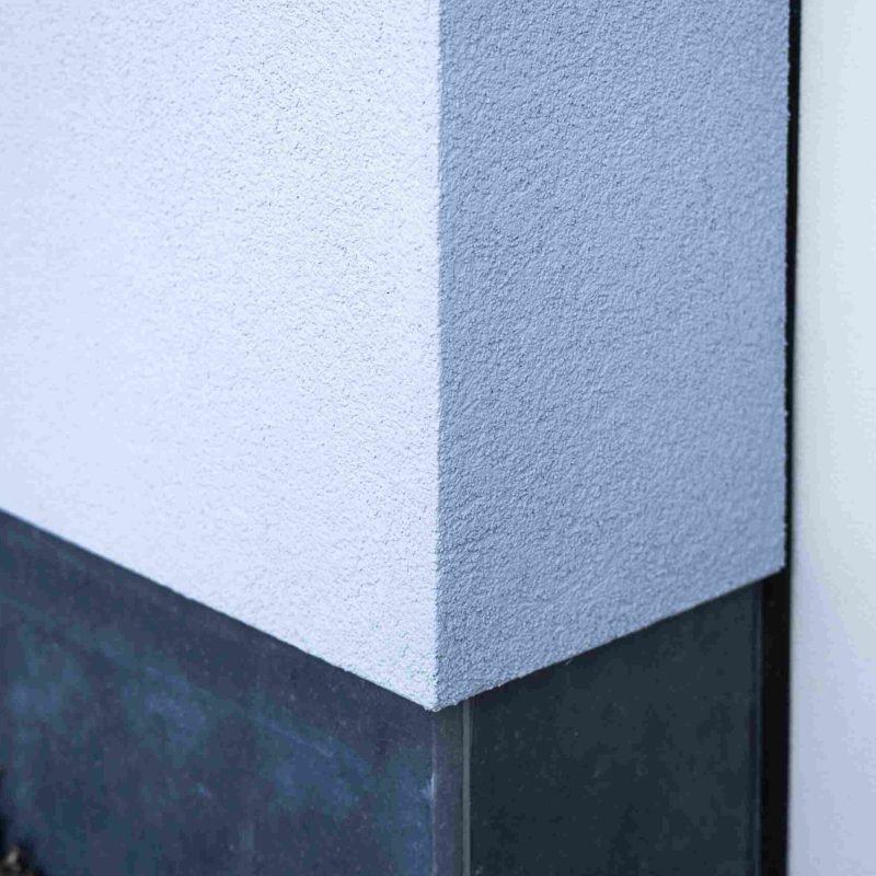 Crepi_11zon Hoek van een gestuukte muur buitenkant gebouw